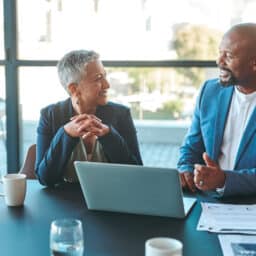 Two people talking in an office