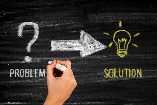 Chalkboard with "problem" and an arrow pointing to "solution."